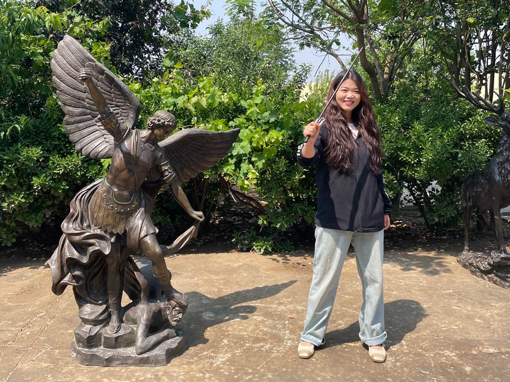 Amy with Bronze St Michael Statue