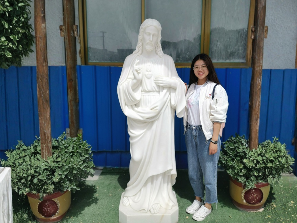 Amy with Marble Jesus Statue