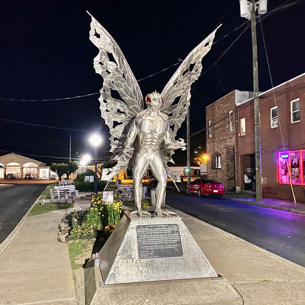 Mothman statue at night