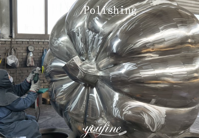 Stainless steel pumpkin sculpture polishing display