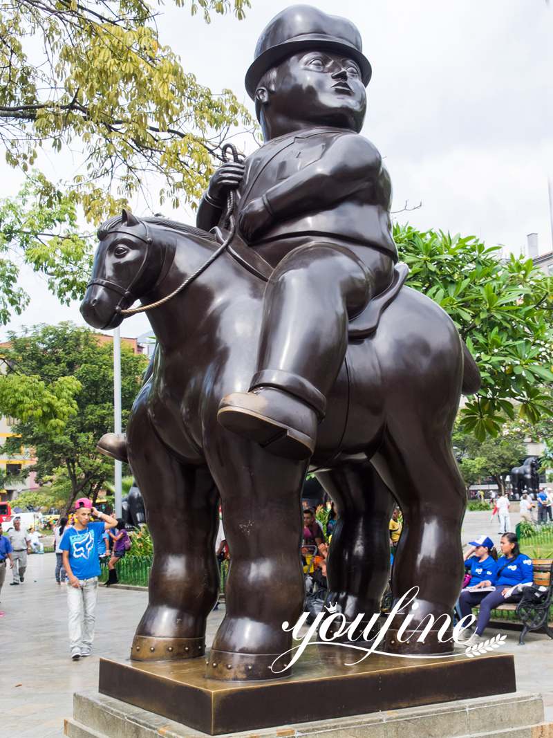 bronze botero man on horse statue
