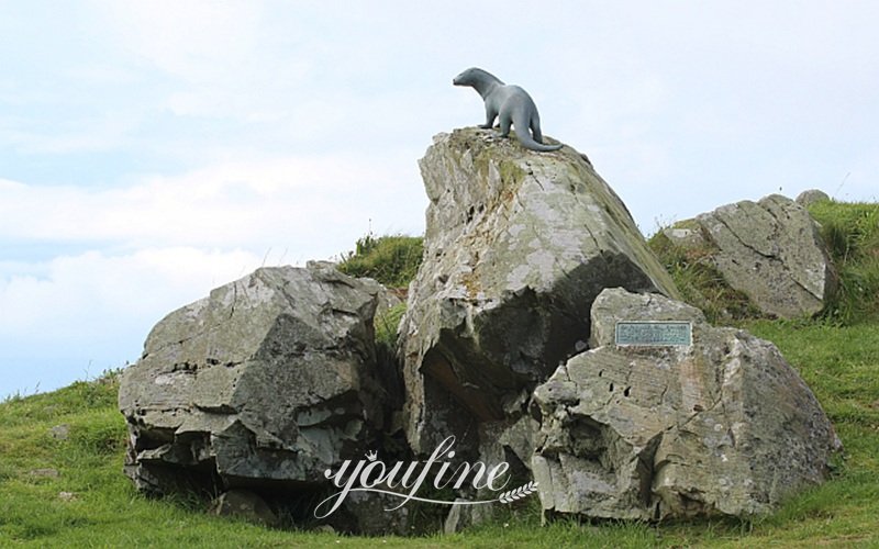 bronze otter sculpture