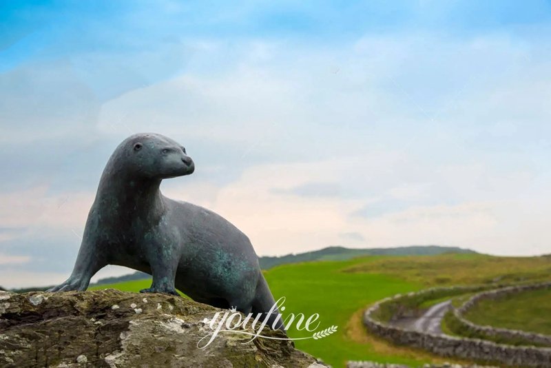 bronze otter sculpture