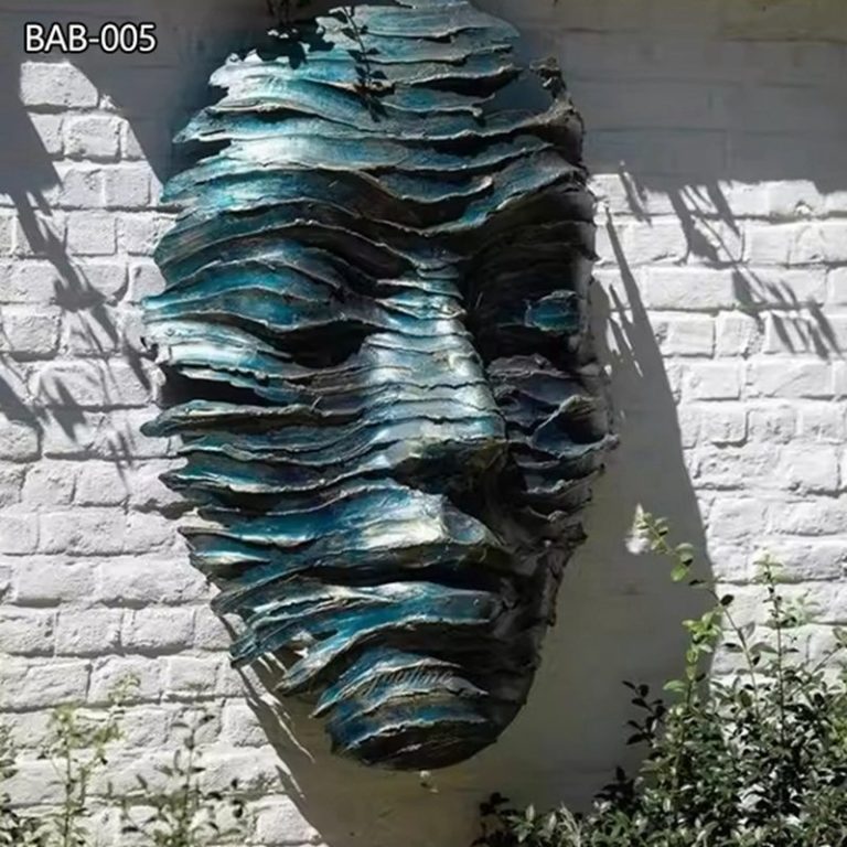 green bronze face sculpture