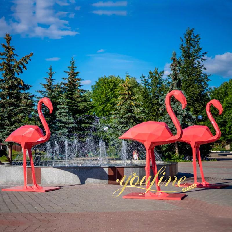 large metal flamingos