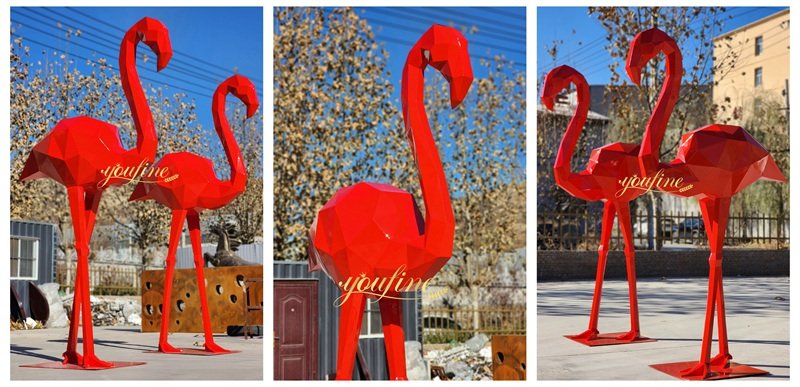 large red metal flamingos