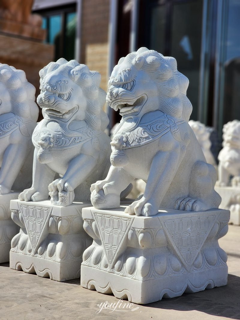 lion statues in front of house