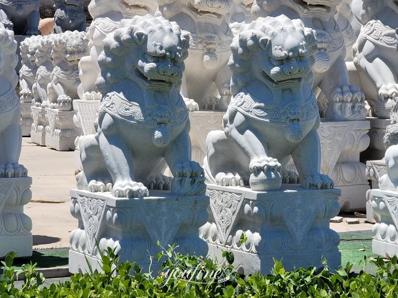 lion statues in front of house