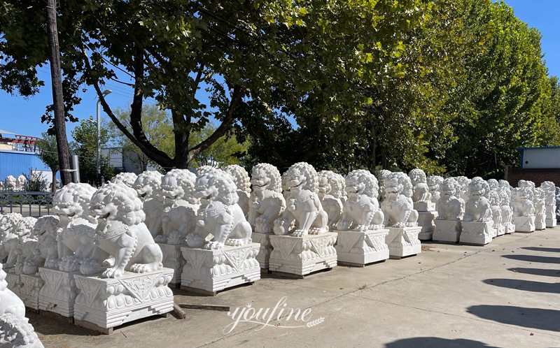 lion statues in front of house