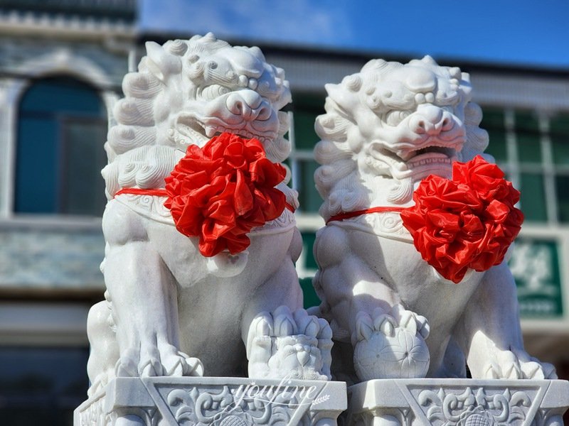 lion statues in front of house