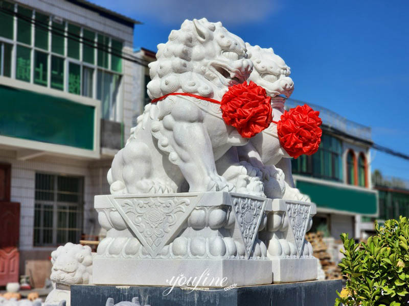 lion statues in front of house
