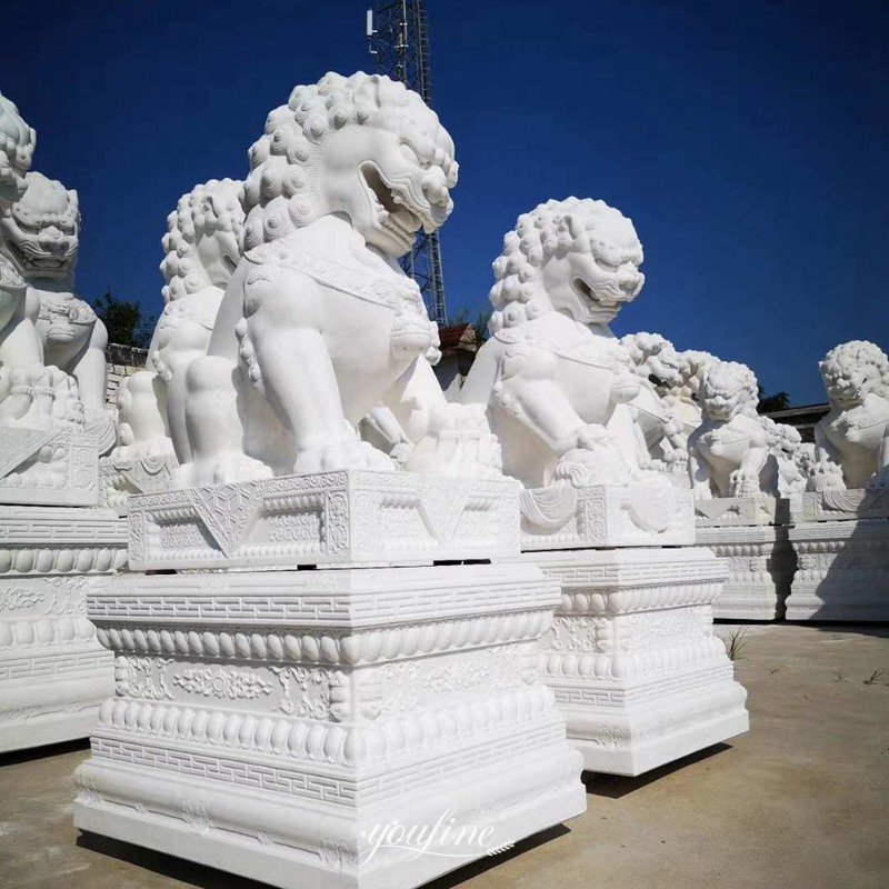 lion statues in front of house