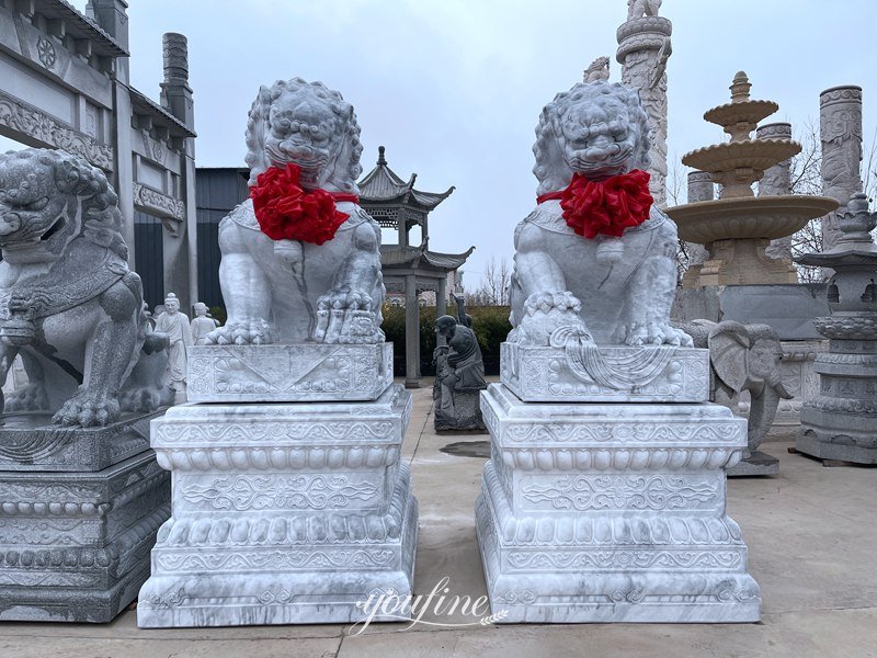 lion statues in front of house