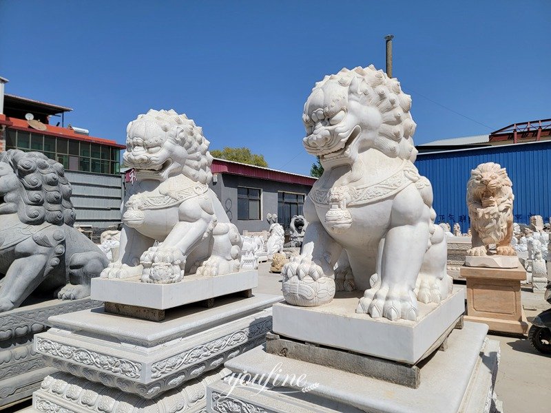 lion statues in front of house