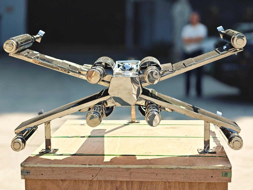 stainless steel X-wing fighter jet sculpture back view